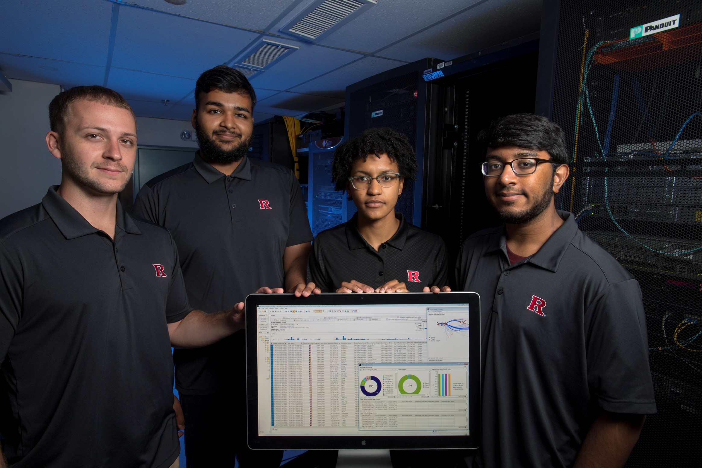 Four Rutgers students (l. to r.) Mathew Benitez (SCI/SAS '19), Jason Jacob (SCI/SMLR'20), Casandra Begin (SCI'19, SCI '20 masters) and Manav Patel (SAS '21) are learning the ropes of cybersecurity and getting hands-on experience and training through OmniSOC – a shared cybersecurity operations center for higher education co-founded by Rutgers and located at Indiana University. 2019
